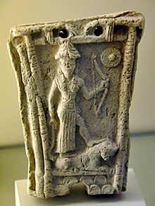 goddess-ishtar-stands-on-a-lion-and-holds-a-bow-god-shamash-symbol-at-the-upper-right-corner-from-southern-mesopotamia-iraq-7534278